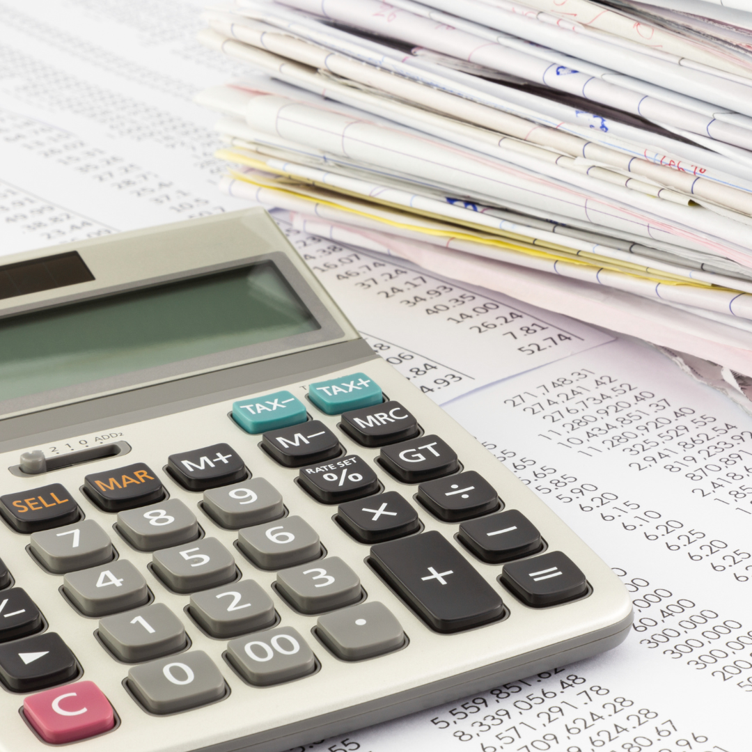 Bookkeeping solutions Calculator on a table with papers and printed numbers.